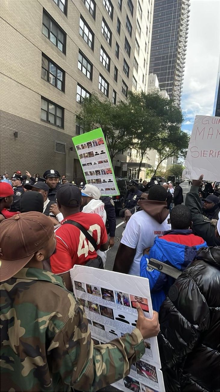 NYPD officers positioned inside the protest interaction zone next to a grievance board
